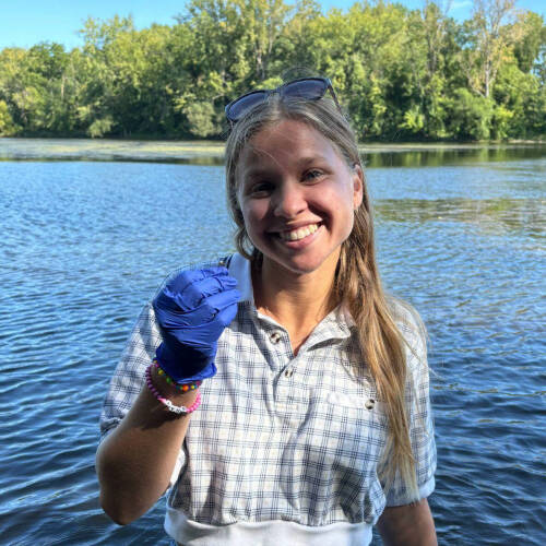 Josie Kuhlman displays a spider.